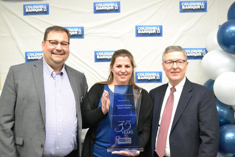 Recognizing Coldwell Banker Resort Realty’s 35-year designation as a Coldwell Banker franchise location are (l-r) Todd Keffer, Mid-Atlantic brand ambassador for Coldwell Banker Real Estate LLC; Kathy Newcomb, senior vice president; and Bruce Plummer, broker and chief operating officer. SUBMITTED PHOTOS